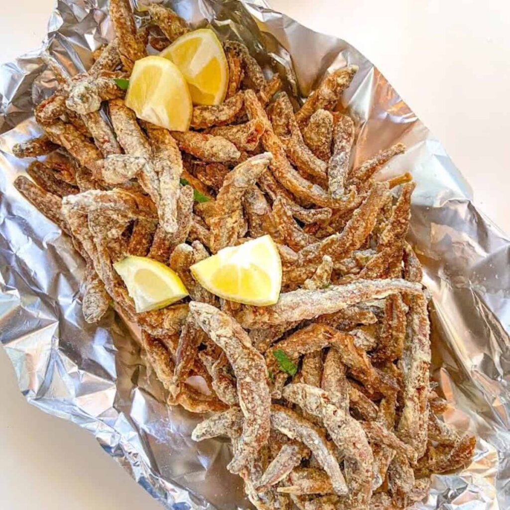 gluten free fried smelt with lemon wedges