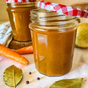 2 jars filled with stock on a table.