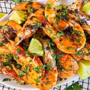 Grilled prawn with chili honey butter on a platter.