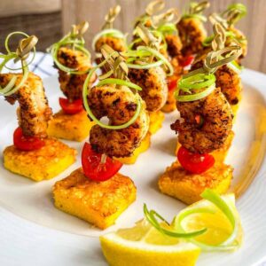 shrimp and grits bite on a serving platter.