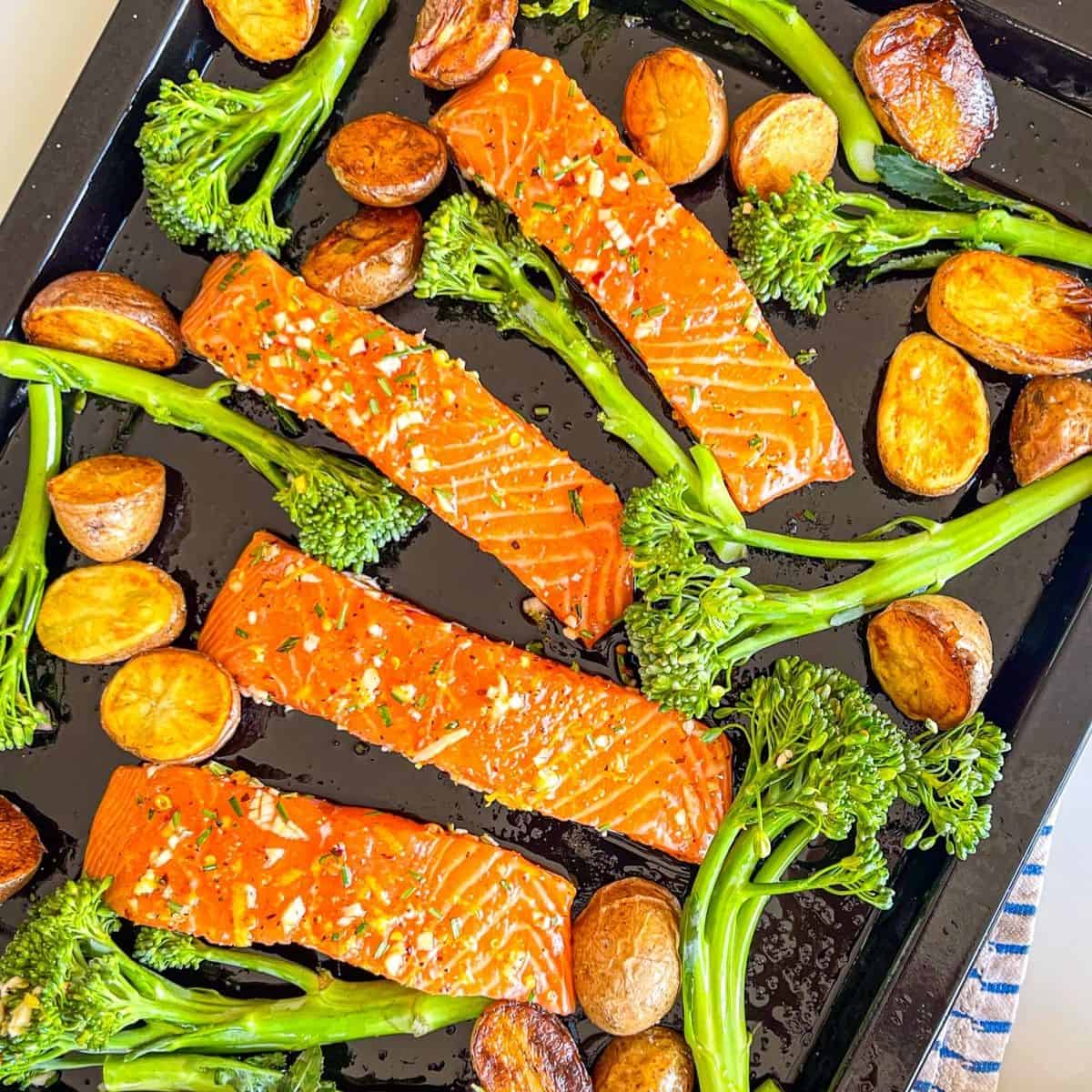 Garlic Herb Marinated Salmon with broccoli and potatoes.