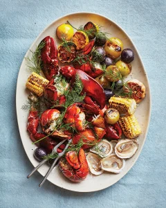 Recette de homards grillés au maïs, aux tomates et aux pommes de terre